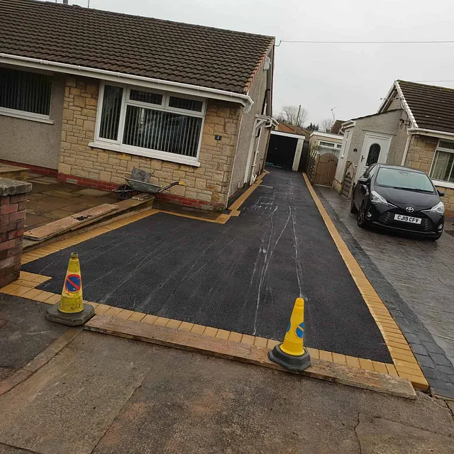 tarmac and brick drive